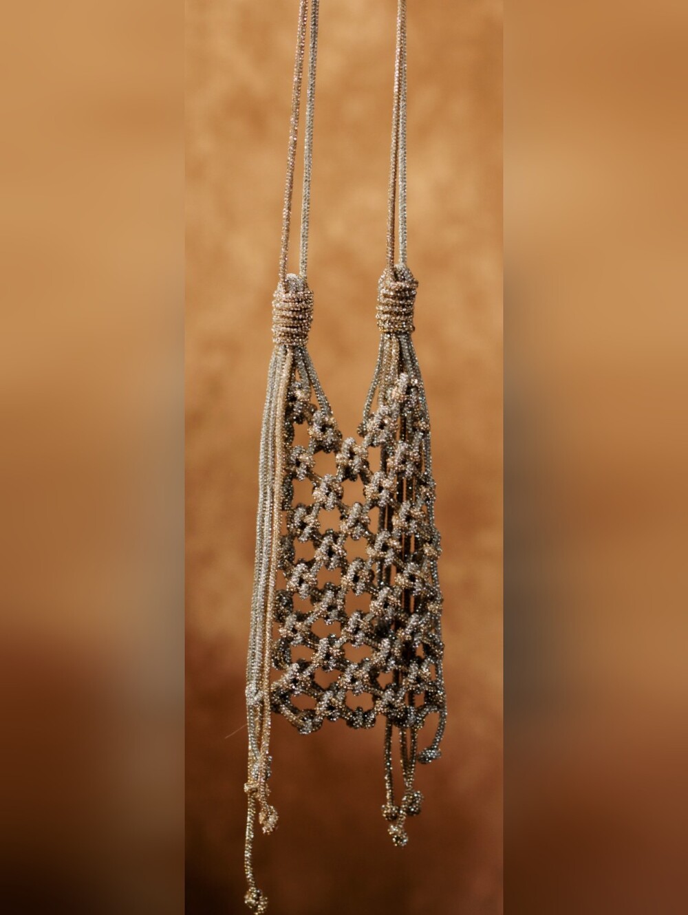   Ornate, handcrafted phone bag.